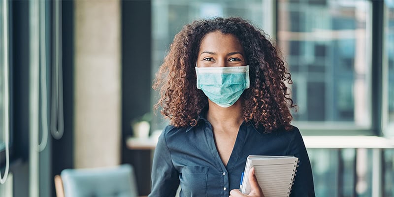 Woman working and wearing a mask