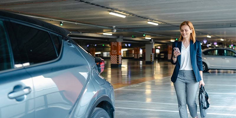 Business person in parking lot
